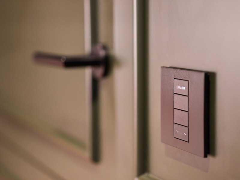 Smart light switch installed on a wall in a modern home